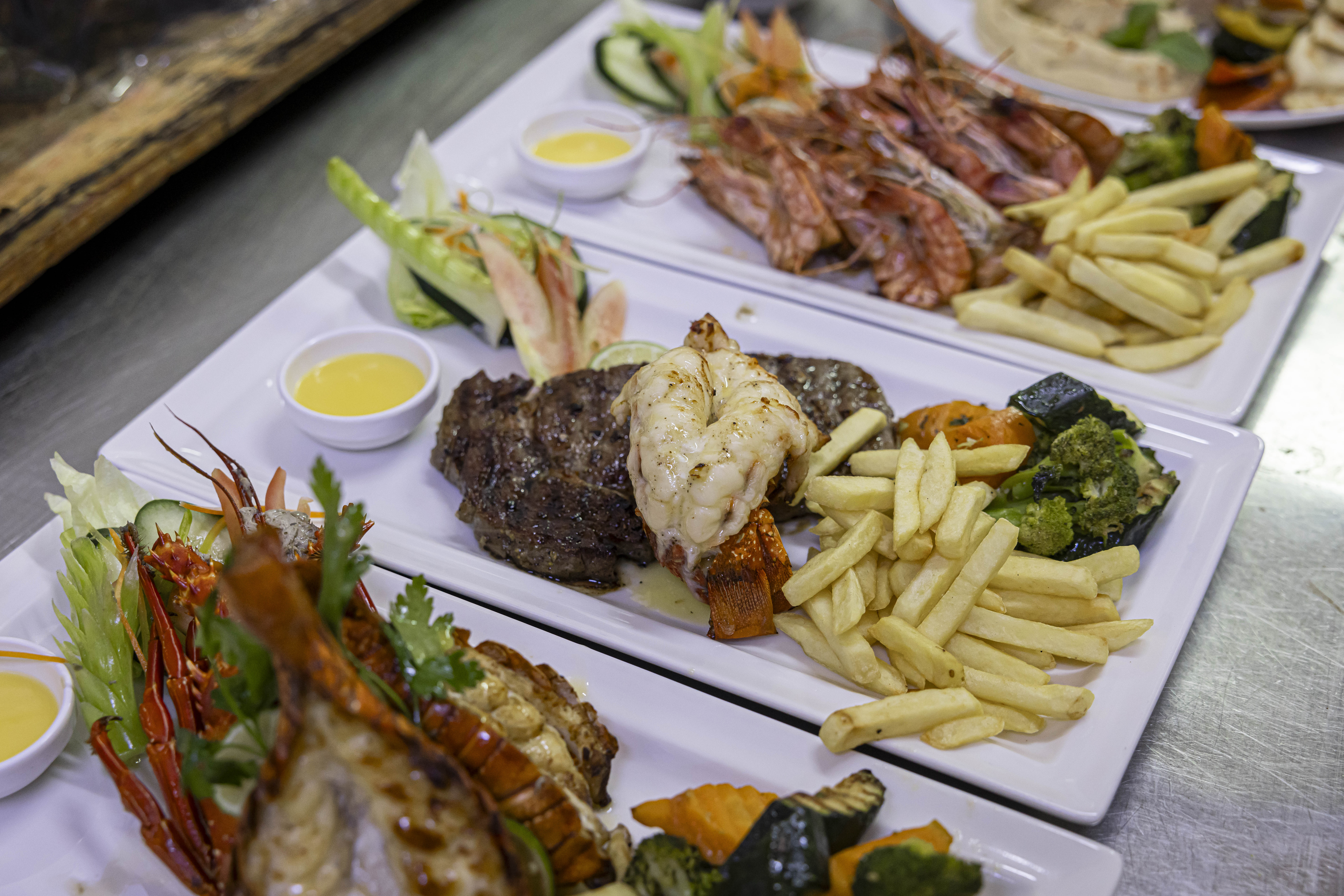 Surf and Turf plates for dinner at Chelsea Village Hotel - 3 meals a day form part of our all-inclusive accommodation offer